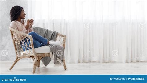 Perfect Day Off Cheerful Black Woman Relaxing In Wicker Chair With Coffee Stock Image Image