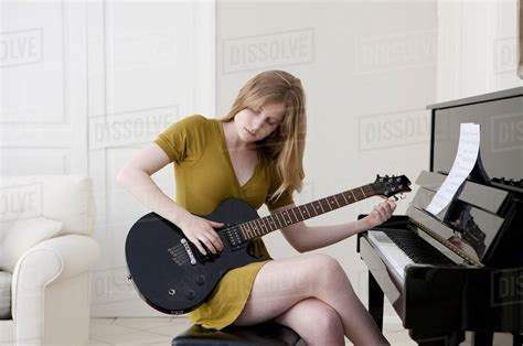 Teenage Girl Playing Electric Guitar Stock Photo Dissolve