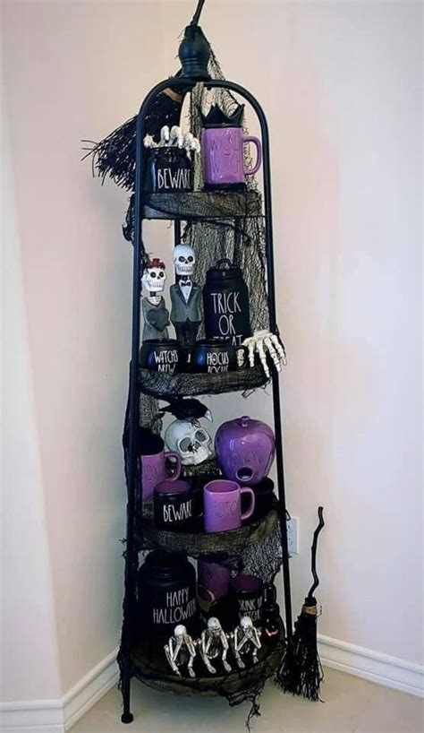 A Black Shelf With Halloween Decorations On It