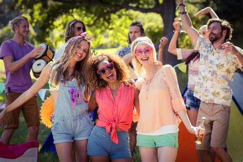 Group Of Friends Having Fun Together At Campsite Stock Photo Image Of