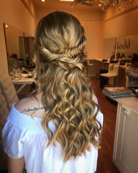 To reproduce this look, create two cornrow braids on each side. Curly Hairstyles for Prom