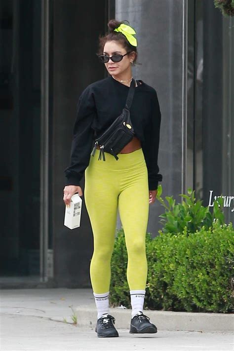 vanessa hudgens in a neon green leggings leaves her workout session with a friend in west