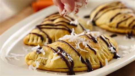 Prepare the basic biscuit dough, substituting 2 tsp almond extract for the vanilla. Grands!® Jr. Banana Empanadas recipe from Pillsbury.com