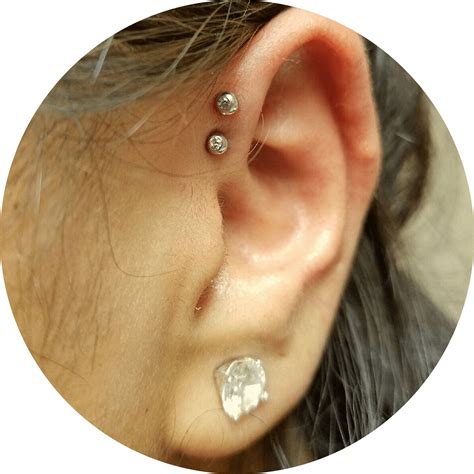 The helix piercing is a perforation of the helix or upper ear cartilage for the purpose of inserting and wearing a piece of jewelry. Helix Piercing MN, ND, IL, & MT | Almost Famous Body Piercing