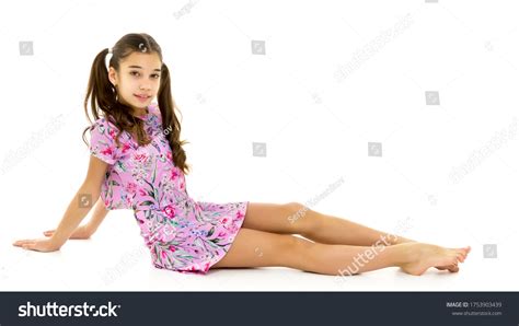 Little Girl Sitting On Floorisolated On Stock Photo 1753903439