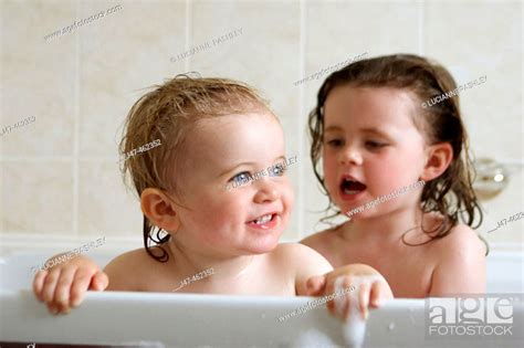 Baby Bathing In The Bathtub Stock Photos And Images Agefotostock