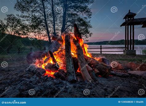 Wonderful Bonfire At Dusk By The Lake In Summer Stock Photo Image Of