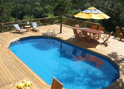 Decking is a good complement for a couple of reasons: 12 Above-Ground Swimming Pool Designs