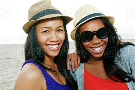 Close Up Of Women Smiling On Beach Stock Photo Dissolve