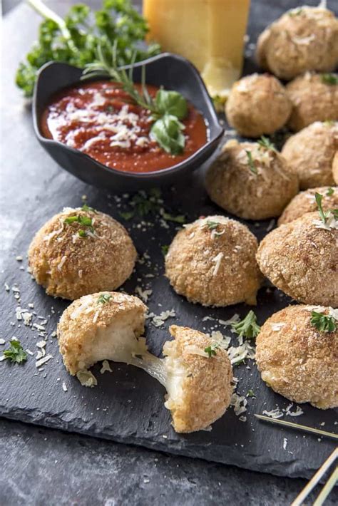 Cook the rice until liquid is almost absorbed, about. These Cheesy Arancini Rice Balls are an Italian street ...