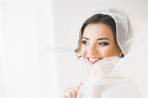 Gorgeous Bride In Robe Posing And Preparing For The Wedding Ceremony