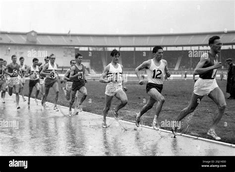 Athletics Runners In 1500 M In Pouring Rain At White City Stadium 6