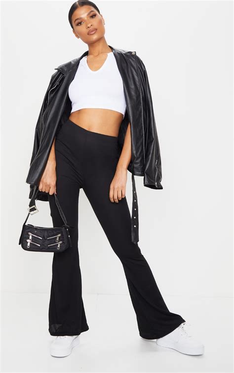 Black Ribbed Flared Pants Pants Prettylittlething Il