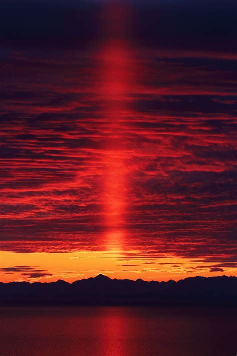 Sunset, also known as sundown, is the daily disappearance of the sun below the horizon due to earth's rotation. Sunset on icy clouds