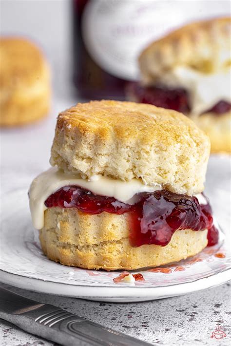 A Biscuit With Jam And Cream On It