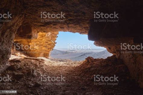 View From The Inside Of A Cave To The Rocky Desert In The Sahara In