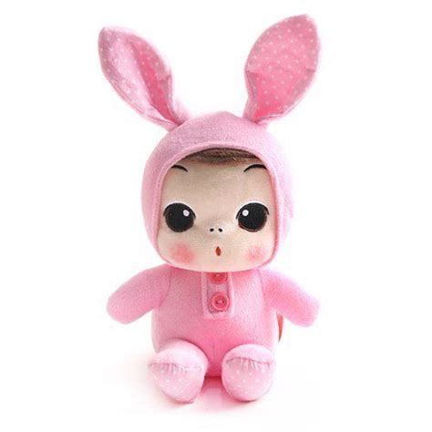 A Small Stuffed Animal Wearing A Pink Bunny Suit With Polka Dots On It
