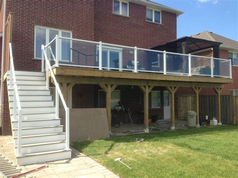 This type of deck needs to be elevated, requiring rails for safety and stairs for backyard access. Great big deck | Backyard design, Outdoor decor, House styles