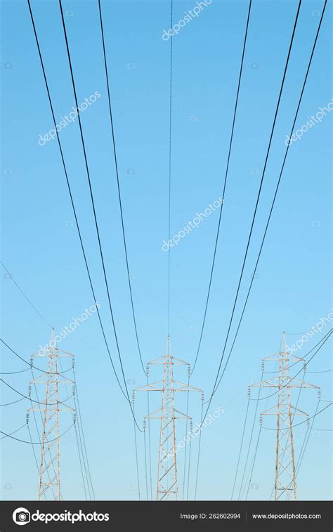 Three Power Masts Power Lines Stretching Them Stock Photo By ©yayimages