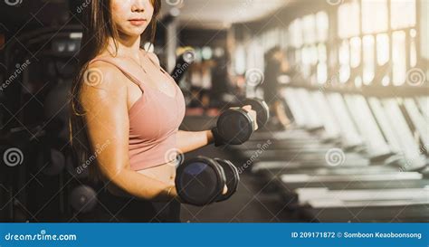 Fitness Weight Lifting Concept Muscle Woman Lifting Dumbbell With Both Arms In Fitness Gym