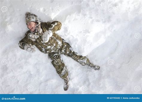 Laughing Boy Laying In The Snow Stock Photo Image Of Freeze Play