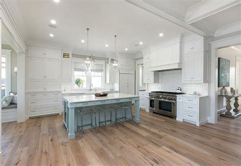 Kitchens are often the heart of the home. White Cabinets with Powder Blue Kitchen Island and Sawn ...