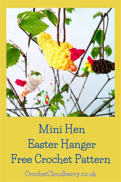 A Crocheted Bird Hanging From A Tree Branch With The Words Mini Hen