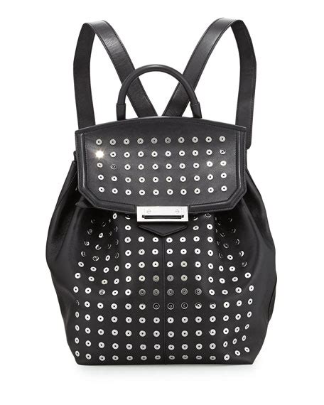 Two adjustable straps with top handle and exterior pocket in the back. Alexander Wang Prisma Studded Leather Backpack, Black