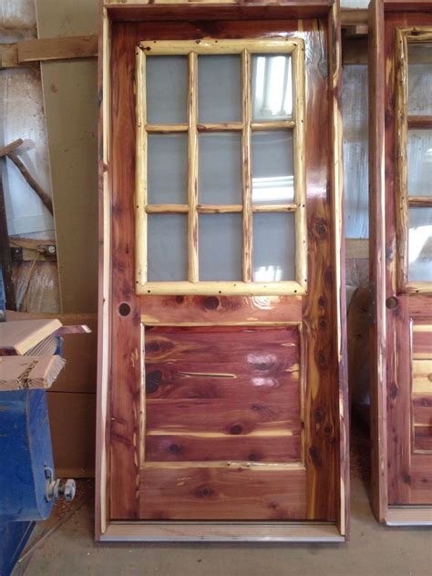 Rustic Red Aromatic Cedar Entry Door With Log Window Frame And Frosted