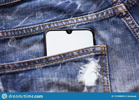 Modern Smartphone With White Screen In Blue Jeans Pocket Stock Image