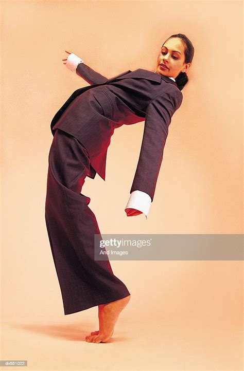 Businesswoman Bending Over Backwards Stock Photo Getty Images