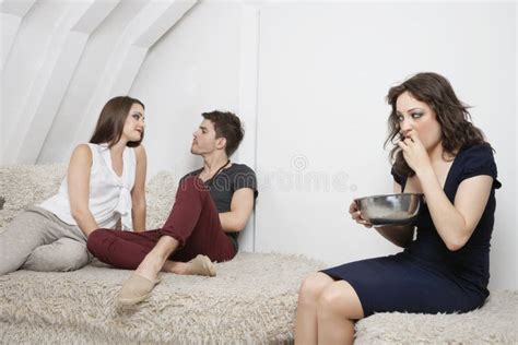 Young Woman Watching Couple Have Quality Time Together Stock Image