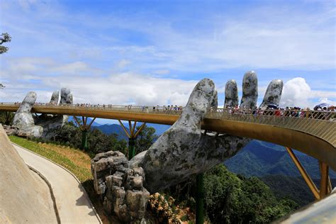 The Hands Supporting The Gold Bridge To Keep The Sky In Da Nang