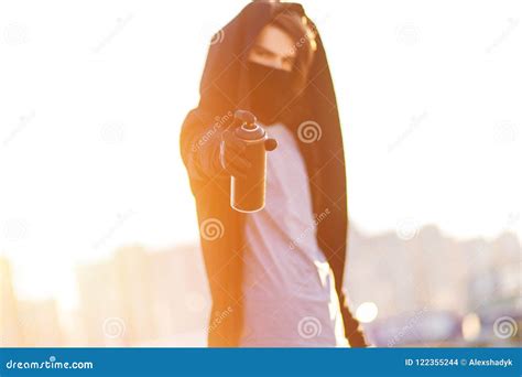 Guy With Spray Can In Hand Graffiti Drawing Sunlight Stock Photo