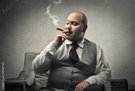 Fat Man Smoking A Cigar Photo Libre De Droits Sur La Banque Dimages