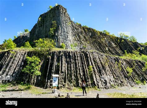 Hegyestu Geological Basalt Cliff In Kali Basin Hungary Near Koveskal With A Tourist Woman Stock