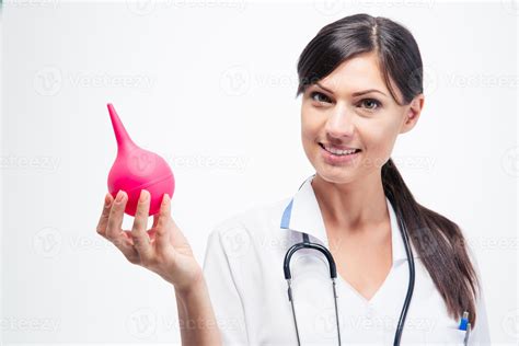 Happy Female Doctor Holding Enema Stock Photo At Vecteezy