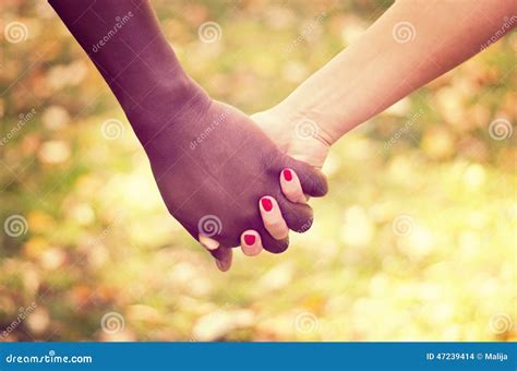 Close Up On A Mixed Race Couple Holding Hands Stock Photo Image Of