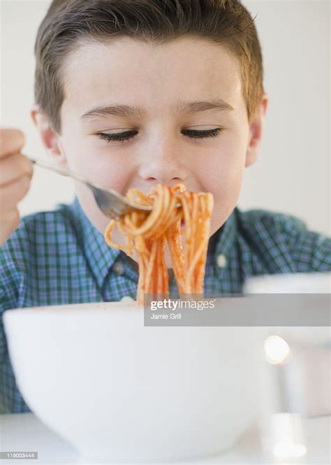 Young Boy Eating Spaghetti High Res Stock Photo Getty Images