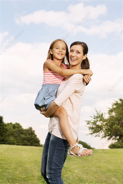 Mother Carrying Daughter Stock Image F0079456 Science Photo Library