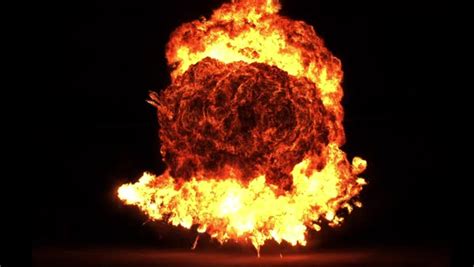 A Huge Slow Motion Explosion On A Black Background Stock Video Footage Dissolve