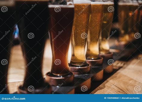 Close Up Of A Rack Of Different Kinds Of Beers Dark To Light On A