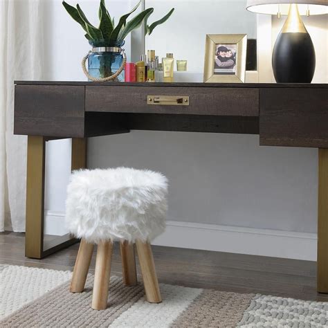Constructed from chrome finished metal, wood and the stool is upholstered with white faux leather fur; OIA White Round Faux Fur Stool 87992W1P | Vanity seat, Latest furniture designs, Faux fur stool
