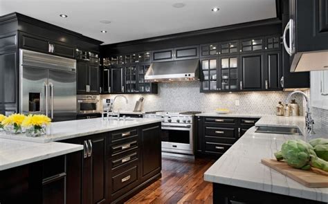 What is the best white paint for cabinets? Elegant Kitchen Featuring Black Cabinets With White ...