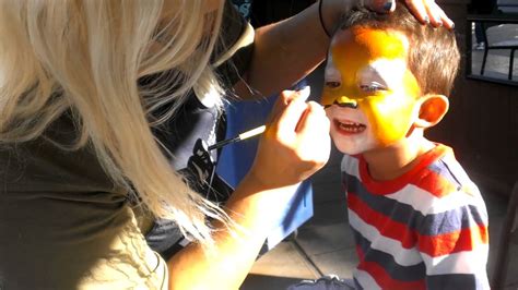 Logan Getting A Face Paint Of A Tiger Youtube