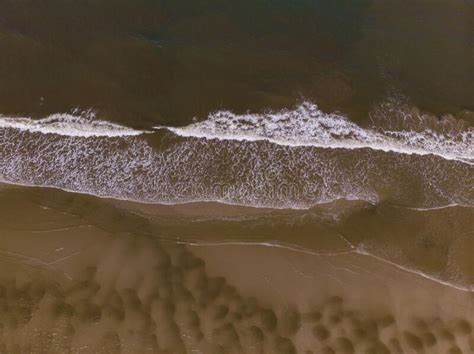 Aerial Drone Image View Of Ocean Waves Crashing On Beach Stock Image