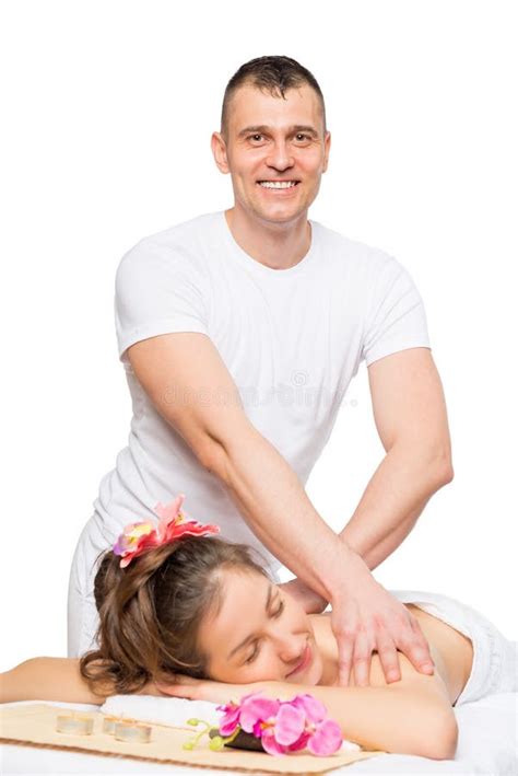 A Male Massage Therapist Massages Female Legs Using A Gentle Body Scrub Foot Scrub At The Spa