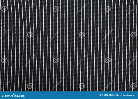Black Textured Knitted Fabric With White Stripes Vertical Pattern