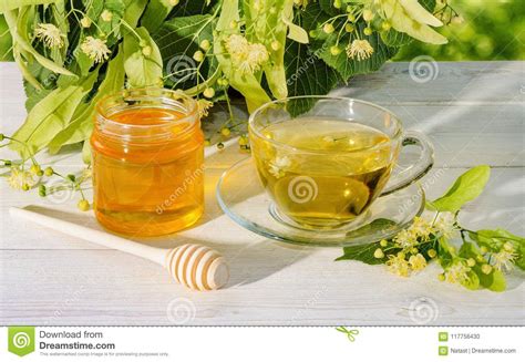 Jar Of Linden Honey, Cap Of Linden Tea And Branch With Linden Flowers On A Sunny Day Stock Photo ...