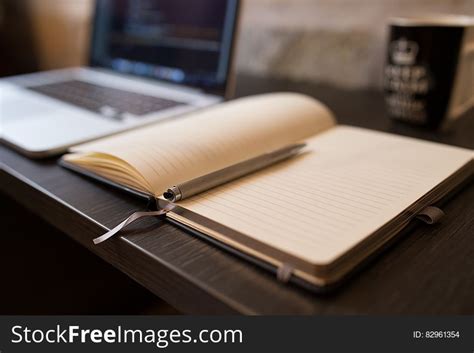 Notebook And Pen On Desk With Computer Free Stock Images And Photos